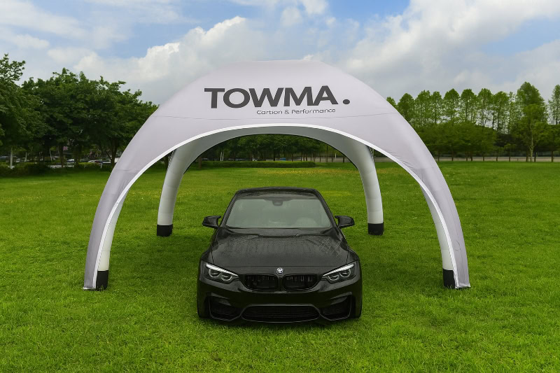 TOWMA white inflatable arch with BMW car on grass