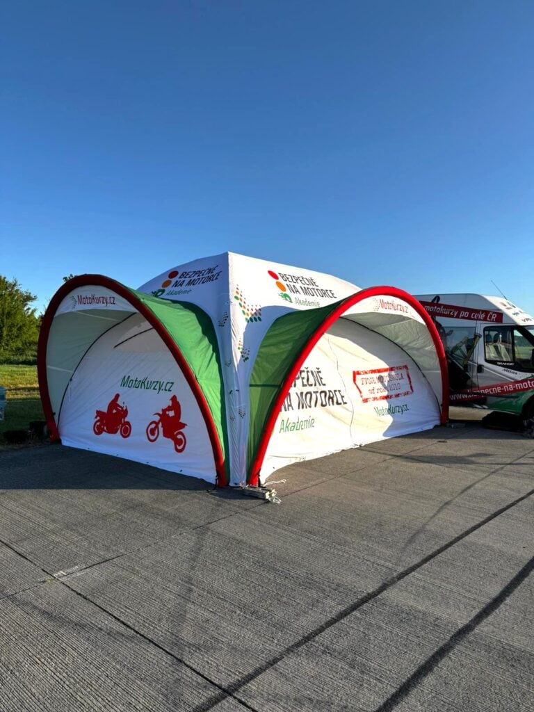 KCCE custom-printed inflatable dome tent photographed on site at a real event