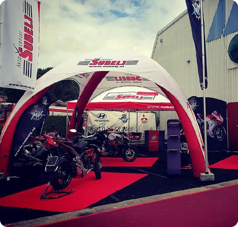Inflatable dome and awnings covering a motorcycle dealer's outdoor display